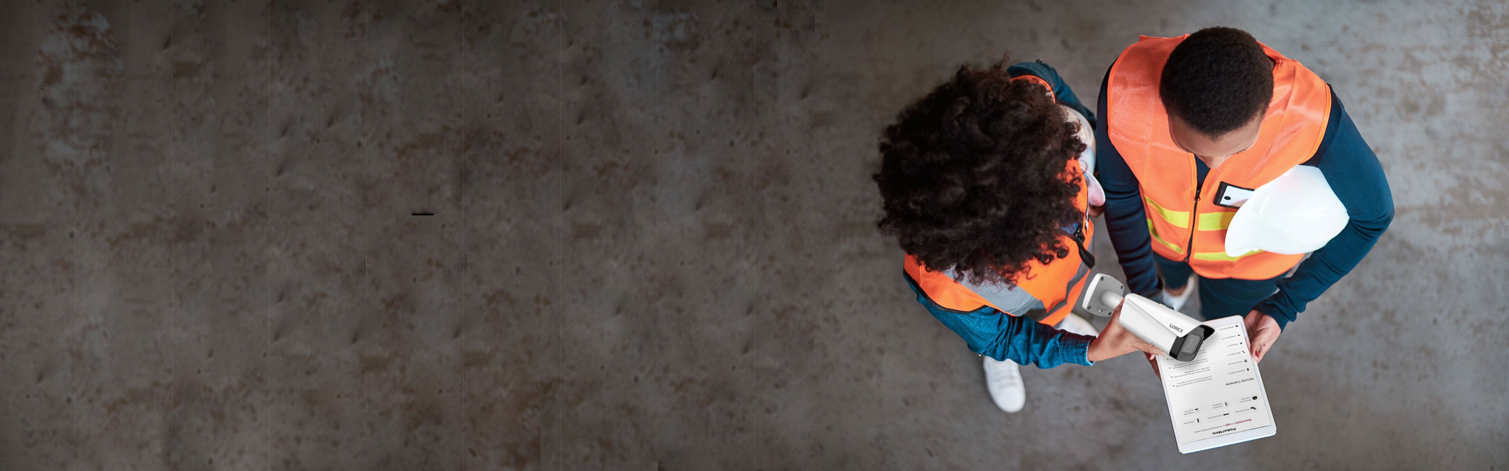 Business Security Camera point of view of a man and woman shopping the Lorex for Business website on tablet