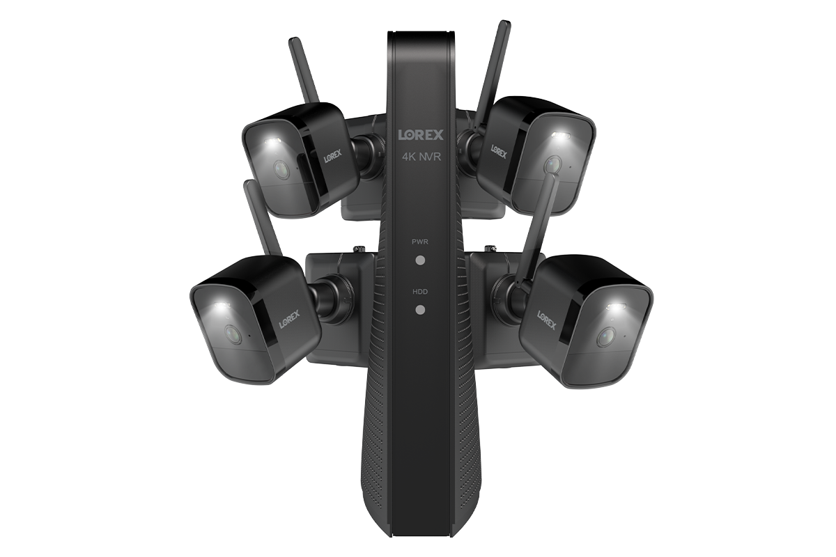 Lorex battery-operated security camera system for business security, featuring four black wireless cameras with built-in spotlights and antennas, connected to a sleek black 4K NVR