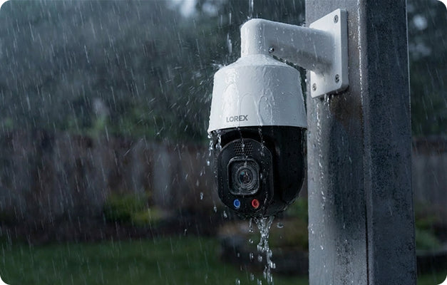 Lorex X Series outdoor security camera operating in heavy rain.
