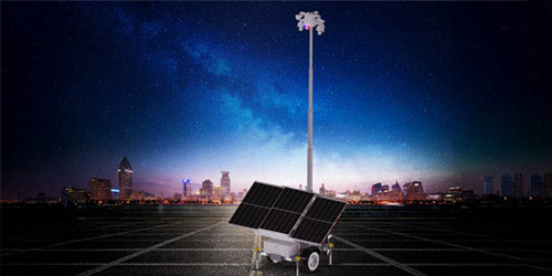  Mobile security camera system trailer with solar panels and a tall telescoping mast, deployed in an empty parking lot at night with a city skyline in the background—ideal for remote, off-grid video surveillance.