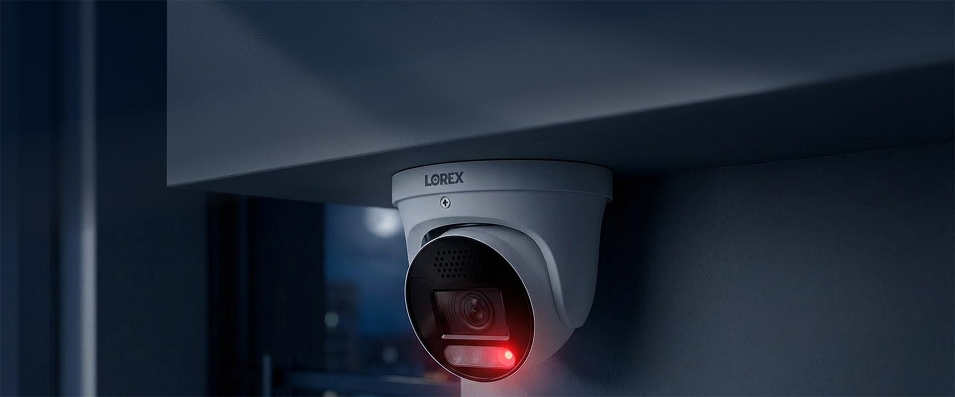 Lynx security camera with red light on a dark background